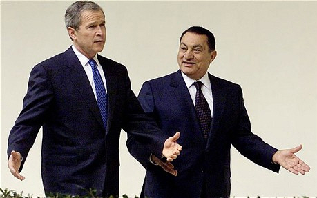 Foto spiegelgedrag George Bush